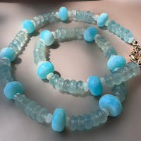 A sky-blue high-quality Peruvian blue opal beaded necklace made by hand with blue chalcedony and Ethiopian opal beads and a goldfilled bolt clasp
