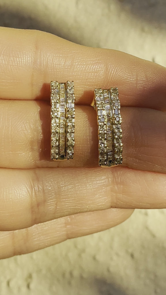 Video of Vintage 10k Yellow Gold .64ctw (I/1) Baguette and Round Diamond Huggie Earrings Shown Held in Hand