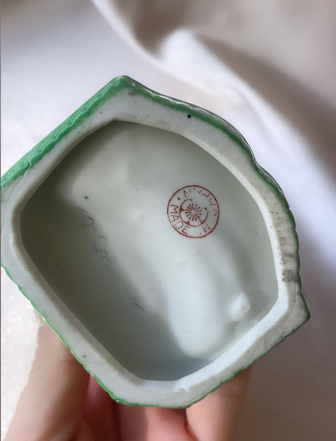 a vintage Japanese export porcelain ring or soap dish with two hand painted figures