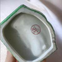 a vintage Japanese export porcelain ring or soap dish with two hand painted figures