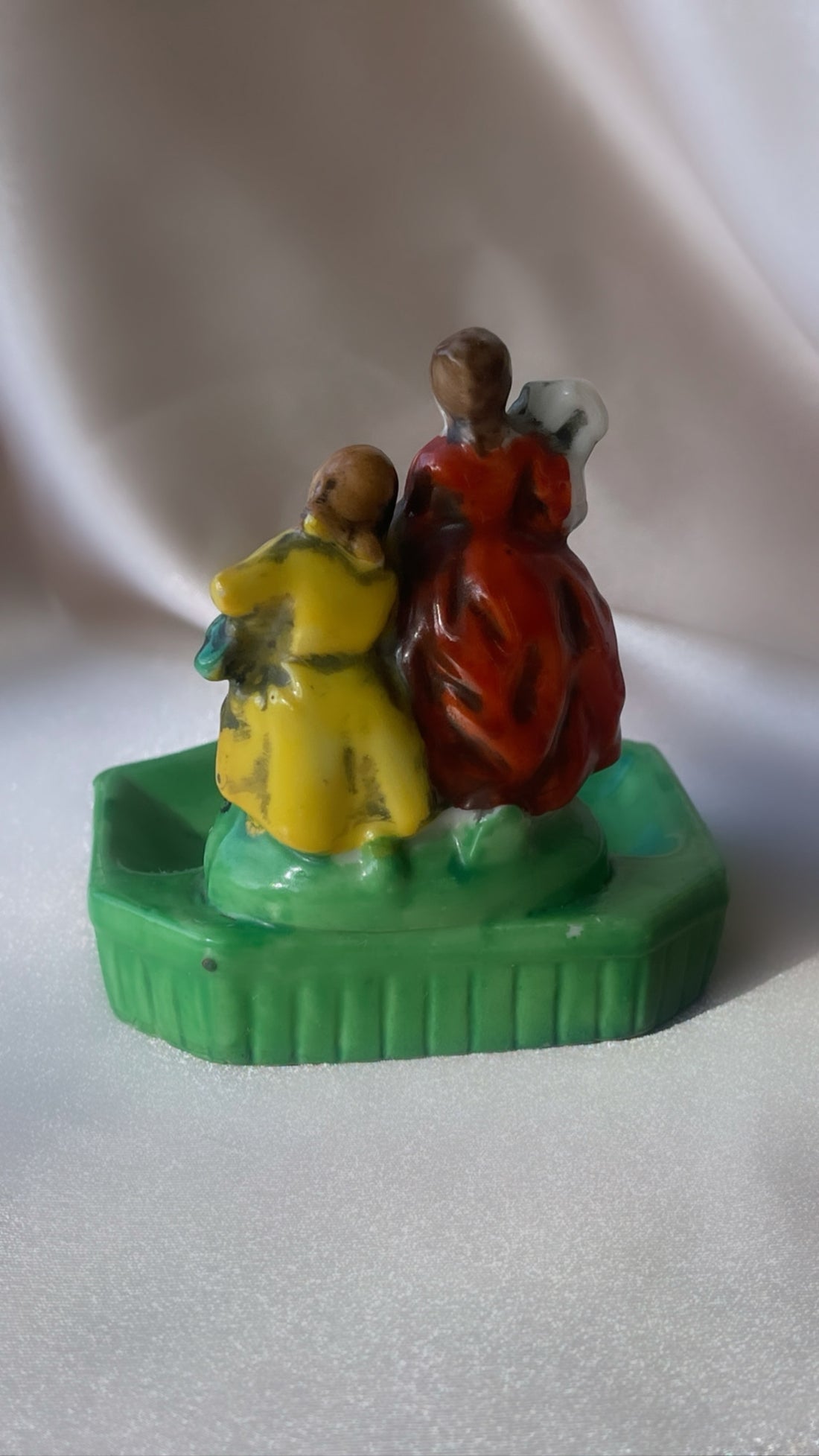 a vintage Japanese export porcelain ring or soap dish with two hand painted figures