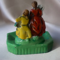 a vintage Japanese export porcelain ring or soap dish with two hand painted figures