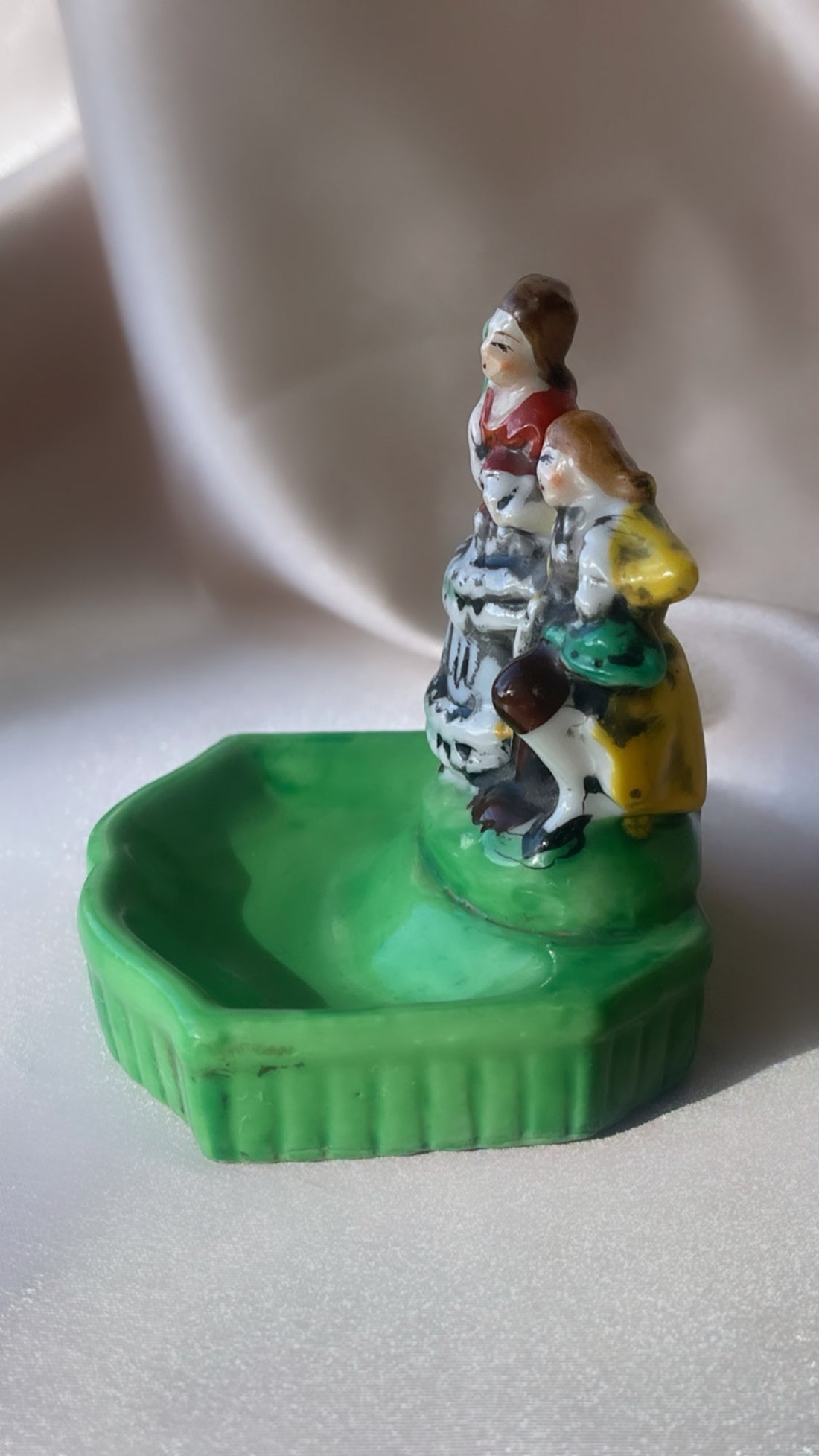 a vintage Japanese export porcelain ring or soap dish with two hand painted figures