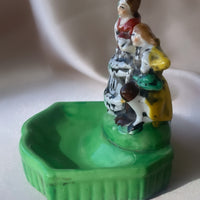 a vintage Japanese export porcelain ring or soap dish with two hand painted figures