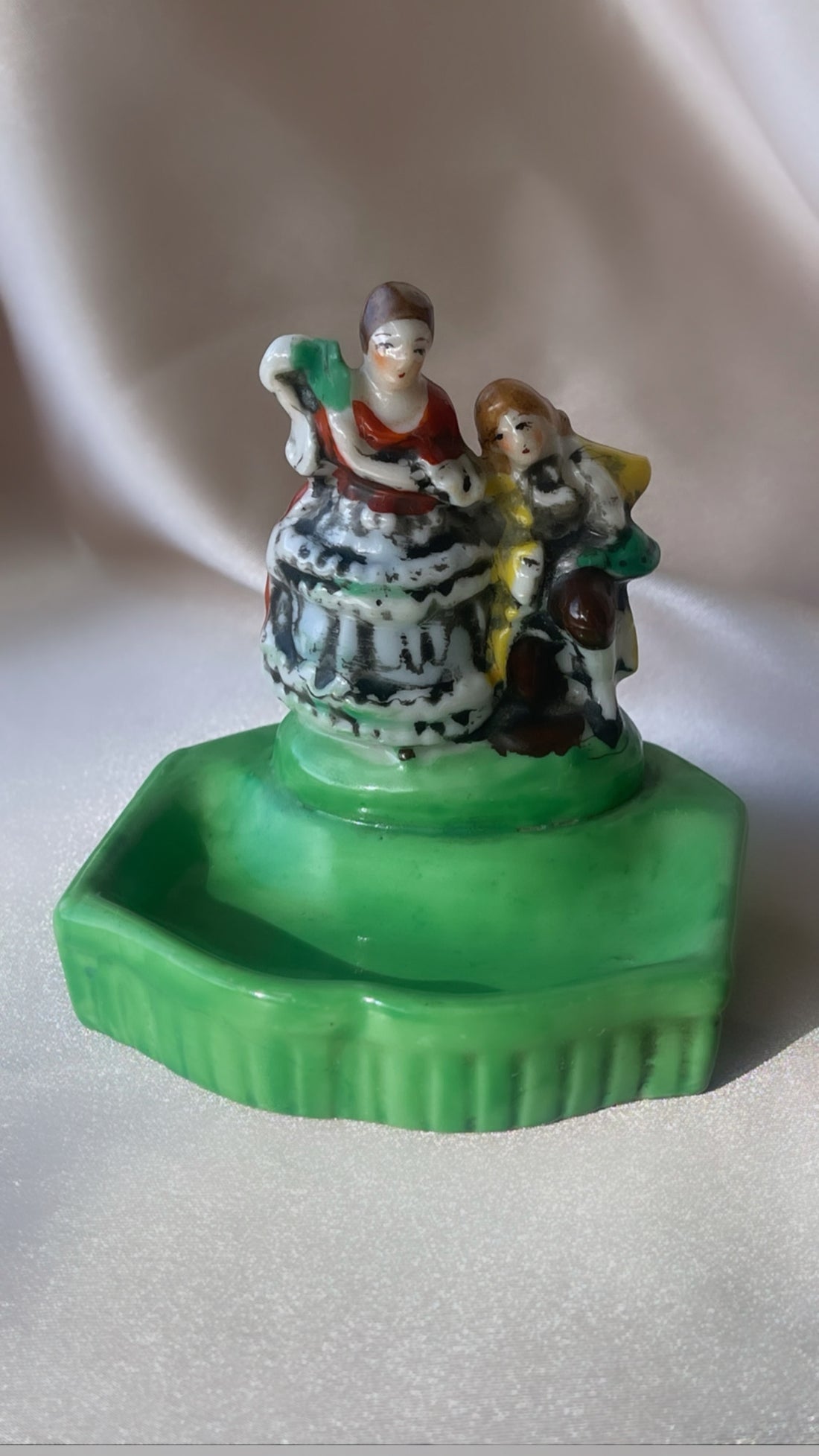 a vintage Japanese export porcelain ring or soap dish with two hand painted figures