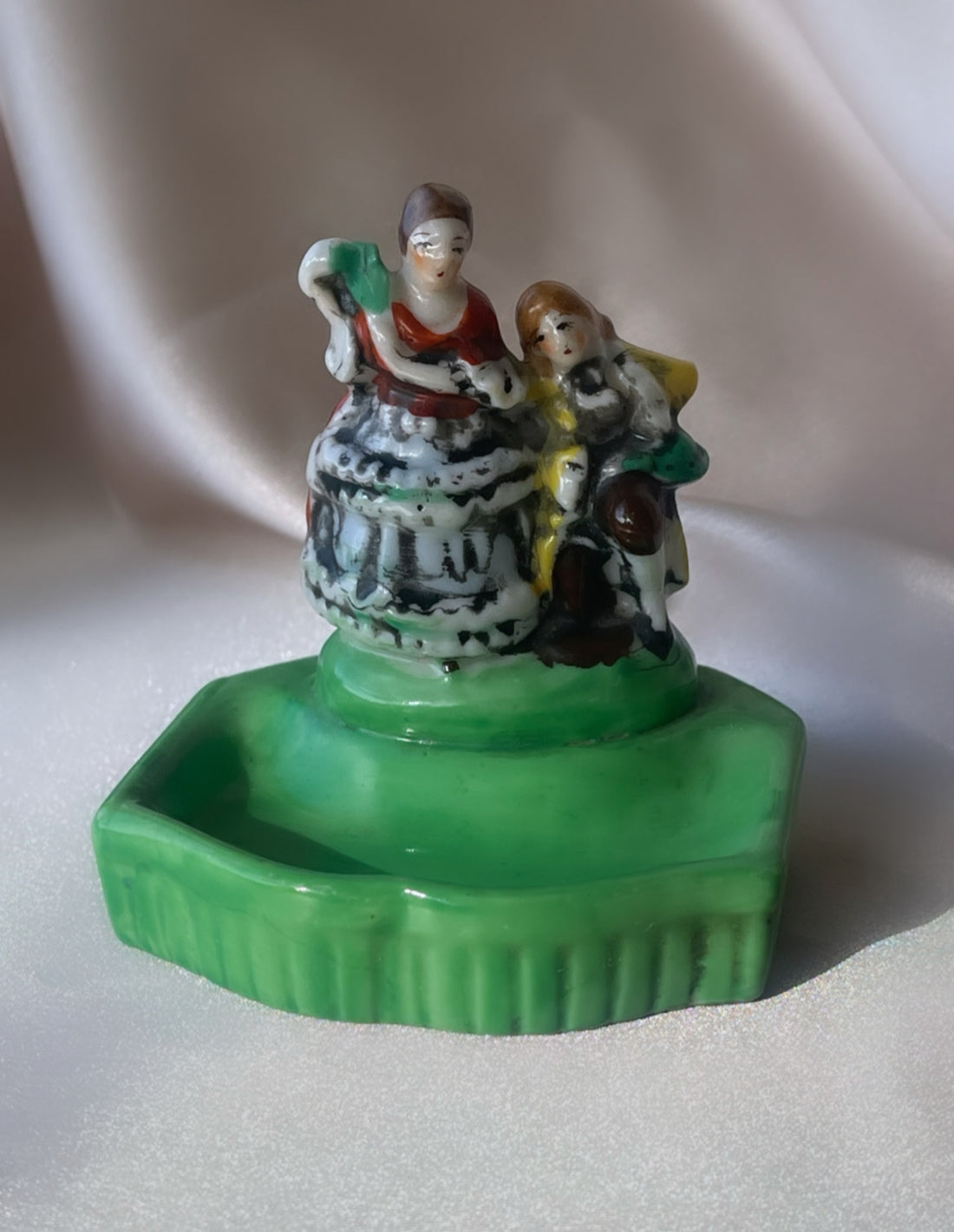 a vintage Japanese export porcelain ring or soap dish with two hand painted figures