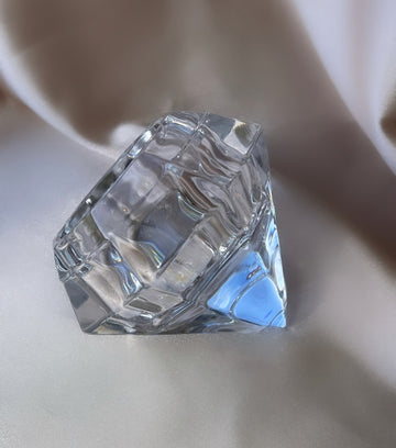 a vintage clear diamond shaped glass leaded crystal paperweight