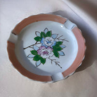 A vintage Japanese handpainted floral ashtray in pink green blue and white