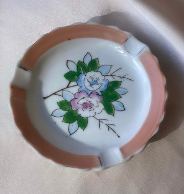 A vintage Japanese handpainted floral ashtray in pink green blue and white