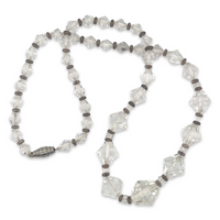 A vintage 1950s Mid Century era costume jewelry beaded necklace with clear faceted plastic crystal beads and silver metal stations