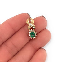 14k Yellow Gold .50ct Emerald and .45ctw Diamond Ribbon Detail Pendant, Emerald with Diamond Halo, May Birthstone Shown in hand for Scale