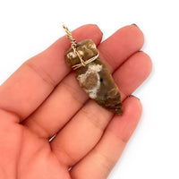 14k Yellow Gold Wire-Wrapped Ancient Agate Arrowhead Pendant in Hand