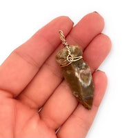 14k Yellow Gold Wire-Wrapped Ancient Agate Arrowhead Pendant in Hand