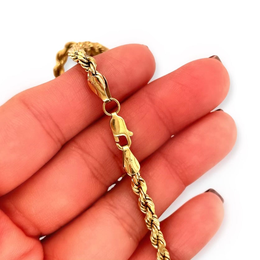 Vintage 14k Yellow Gold 20.25-inch French Woven Sparkle Rope Chain Necklace with Lobster Claw Clasp in hand