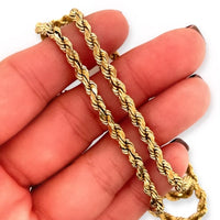 Vintage 14k Yellow Gold 20.25-inch French Woven Sparkle Rope Chain Necklace with Lobster Claw Clasp in hand