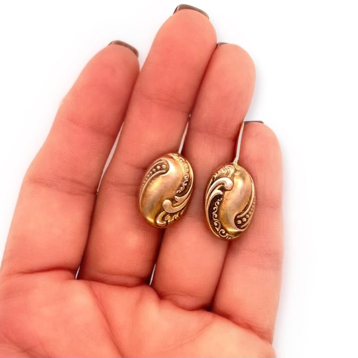 Antique Victorian Repousse Cufflink Conversion Earrings with 14k Yellow Gold Shepherd Hook Ear Wires in hand