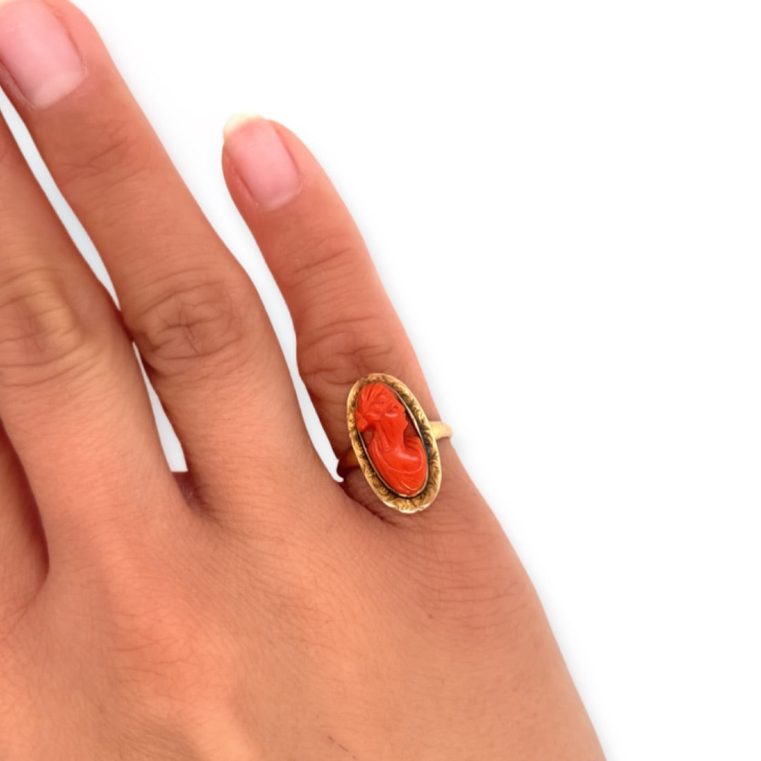 Carved Orange Red Coral Cameo of Woman in Yellow Gold Ring Shown on Pinky Finger