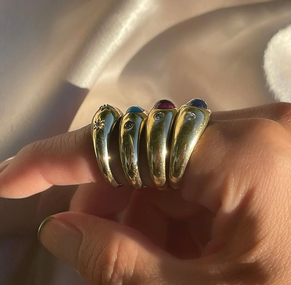 Stack of Flush Set Stone Rings on Hand
