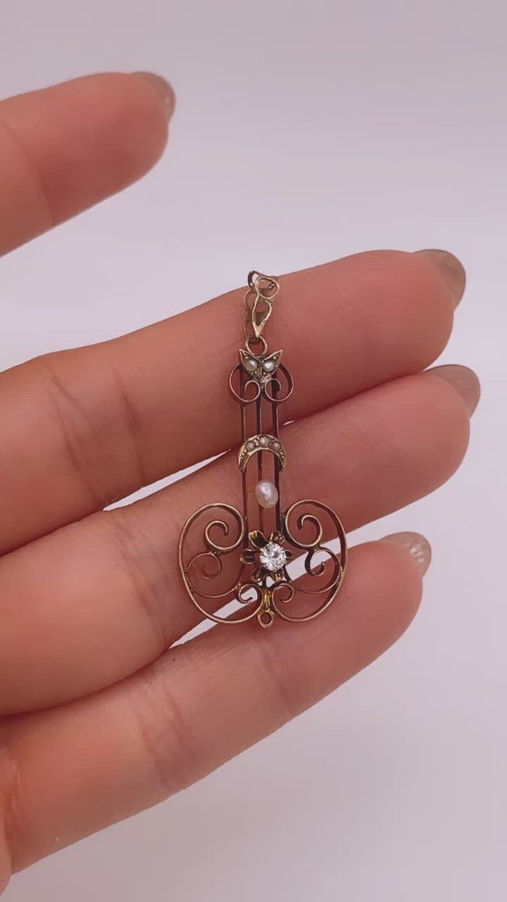 Video of 10k Yellow Gold Victorian Paste and Seed Pearl Lavalier Pendant Shown in Hand