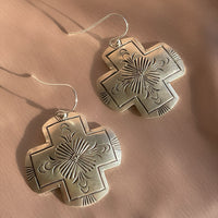 A pair of vintage sterling silver Native American Navajo hand stamped hamemred front cross shaped dangle earrings