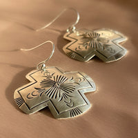 A pair of vintage sterling silver Native American Navajo hand stamped hamemred front cross shaped dangle earrings