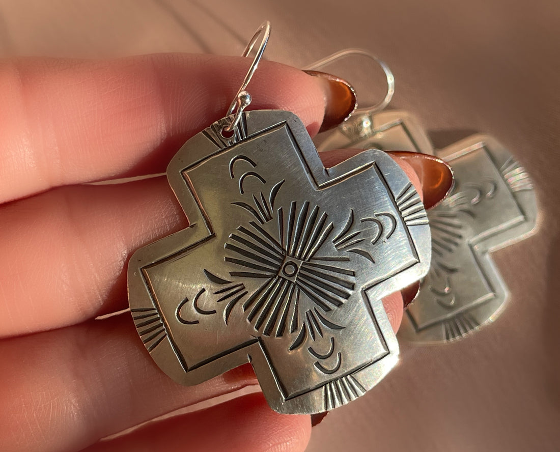 A pair of vintage sterling silver Native American Navajo hand stamped hamemred front cross shaped dangle earrings