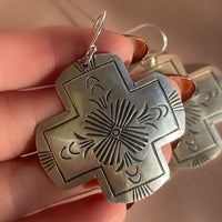 A pair of vintage sterling silver Native American Navajo hand stamped hamemred front cross shaped dangle earrings