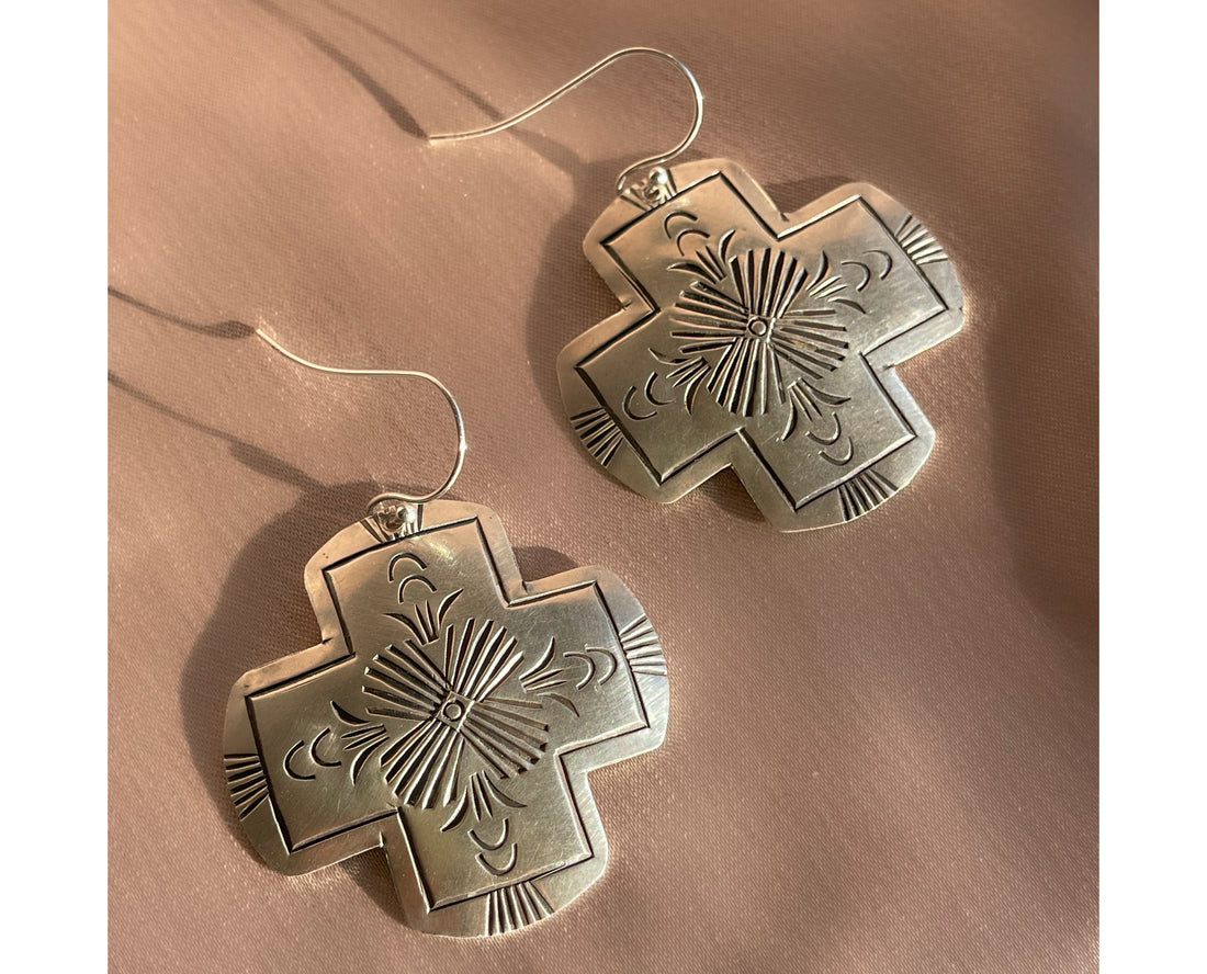 A pair of vintage sterling silver Native American Navajo hand stamped hamemred front cross shaped dangle earrings