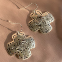 A pair of vintage sterling silver Native American Navajo hand stamped hamemred front cross shaped dangle earrings