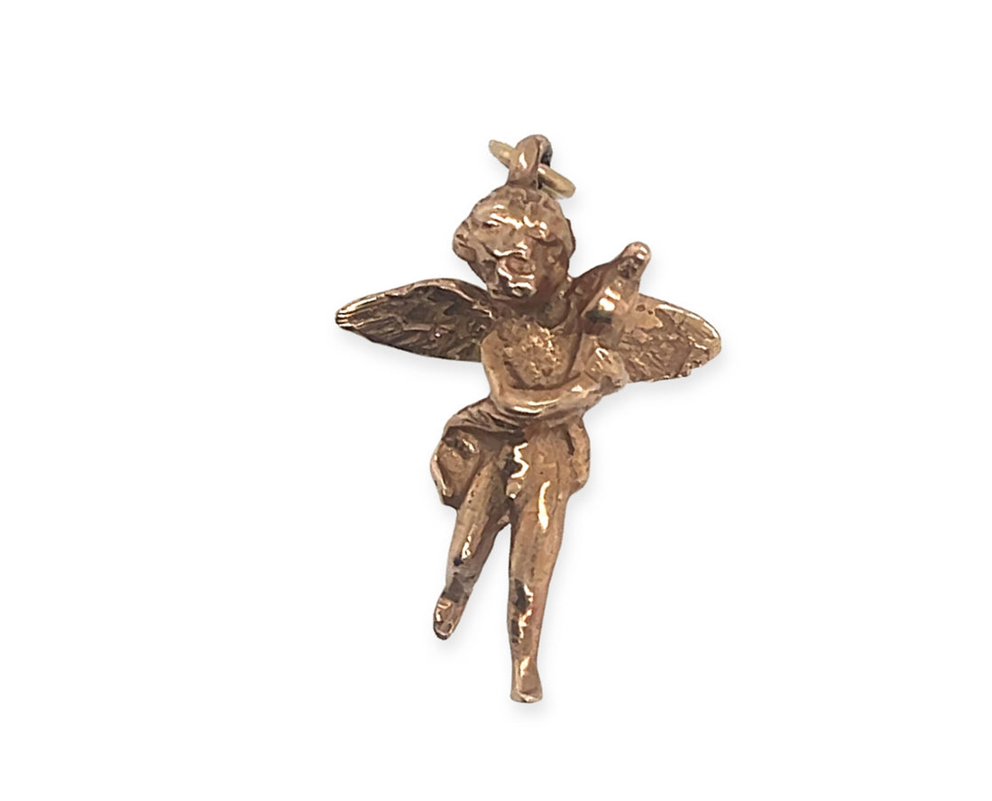 a vintage 10k rose gold 3d cherub pendant