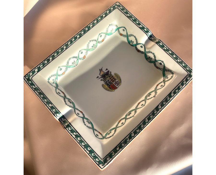 A white porcelain vintage ashtray trinket jewelry dish with a handpainted ship crest