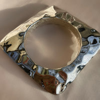 a chunky hammered square vintage sterling silver bangle