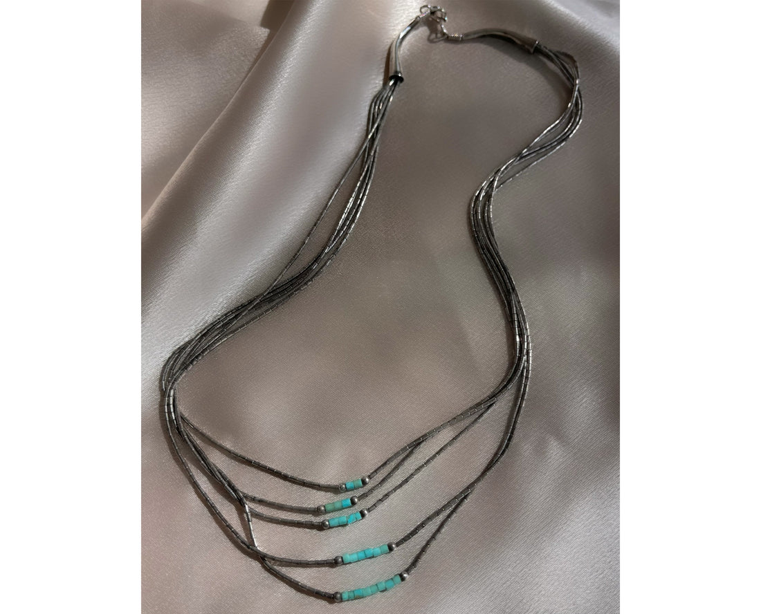 A five strand Native American Navajo vintage liquid silver necklace with sterling silver beads and turquoise