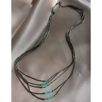 A five strand Native American Navajo vintage liquid silver necklace with sterling silver beads and turquoise