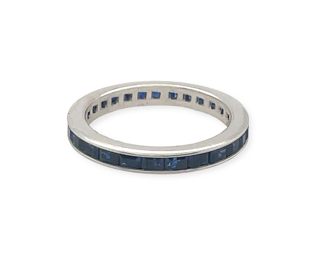 A 14k white gold 2ctw modern blue sapphire eternity band ring