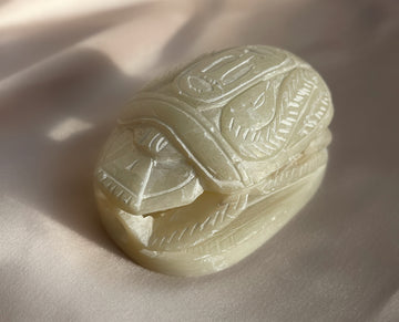 A vintage carved ancient egyptian scarab bug paperweight carved from soapstone