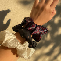 a black vintage silk fabric handmade hair scrunchie scrunchy tie with floral detail