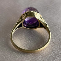 Antique Victorian sugarloaf cabochon amethyst ring with pie-crust bezel and repousse detail on shank in 14k yellow gold